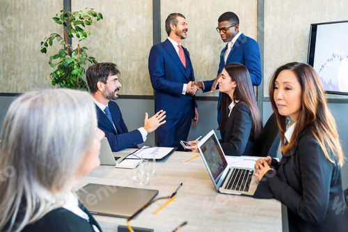 Preview: Diverse businesspeople enjoy meeting in conference room