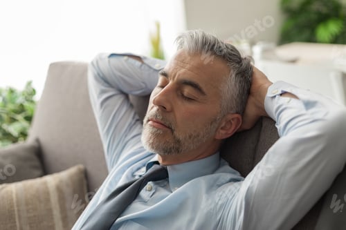 Preview: Businessman sleeping on the couch