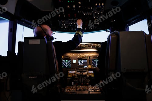 Preview: Captain and african american pilot flying aircraft jet in cabin