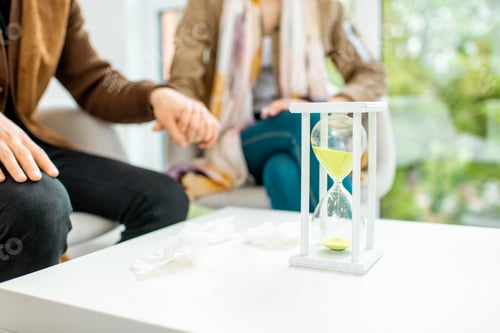 Preview: Couple sitting with psychologist during the mental therapy