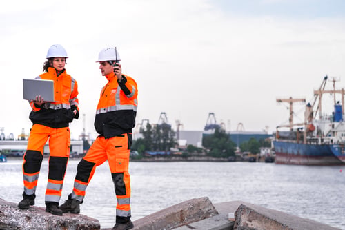 Preview: engineers communicate while inspecting dockside logistics