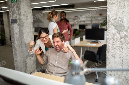 Preview: Happy business people having fun and chatting at workplace office