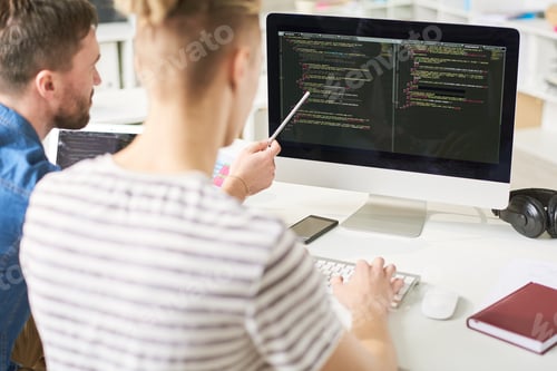 Preview: IT specialists viewing computer code