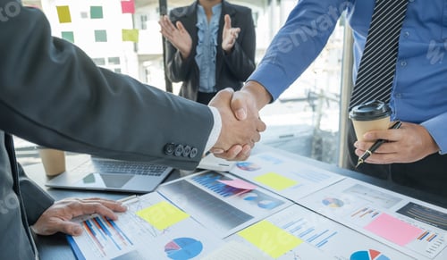 Preview: handshake after businesswomen and businessmen team meeting to plan strategies to increase business