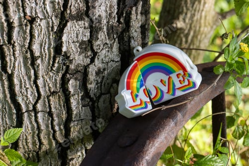 Preview: Pride celebration decor with rainbow-colored items in nature