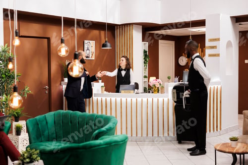 Preview: Hotel staff gives access key card