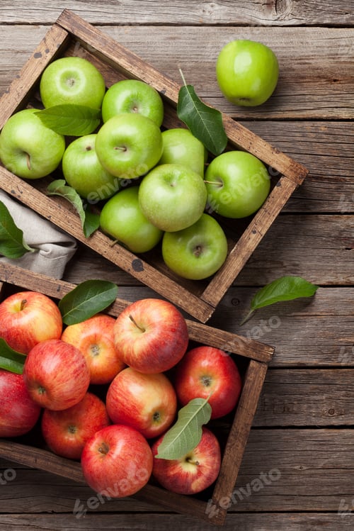 Preview: Green and red apples in wooden box