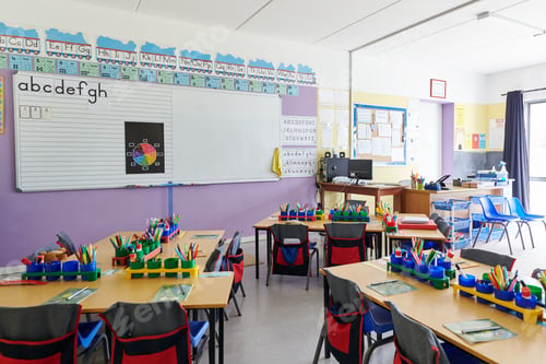 Preview: Empty Classroom In Elementary School With Whiteboard And Desks