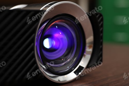 Preview: Closeup view of modern digital video projector on table