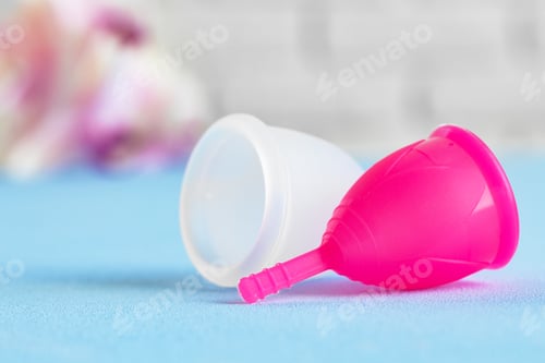 Preview: Two menstrual cups on table close up