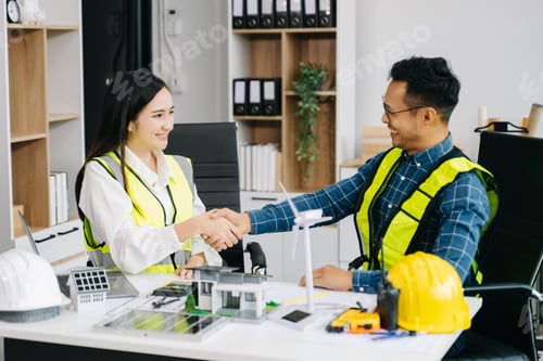 Preview: Engineer teams meeting working together wear worker helmets hardhat with on architectural project si
