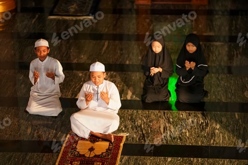 Preview: Children participate in prayer in a mosque during evening worship time