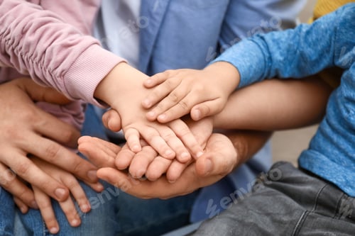 Preview: Closeup view of happy family holding hands