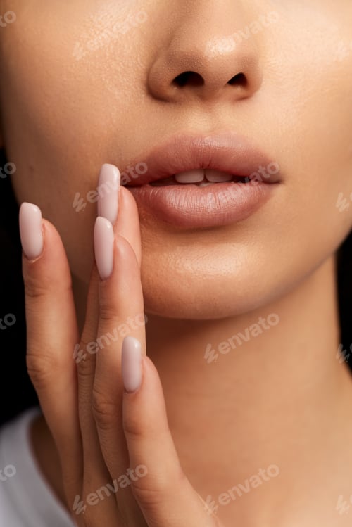 Preview: Crop woman with herpes applying lip balm