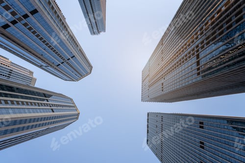 Preview: Low angle view of tall modern buildings under the blue sky