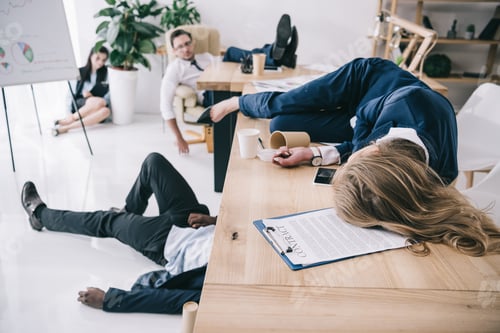 Preview: tired business colleagues sleeping at office