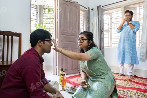 Preview: Indian family performing bhai dooj rituals at home