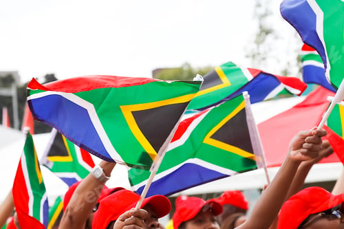 Preview: Group of people with the South African Republic flags in the festival