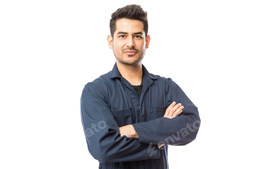 Preview: Confident Mechanic Standing Arms Crossed Against White Background