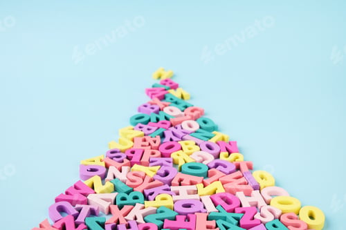 Preview: Many multicolored letters in shape of road. Reading, studying at school.