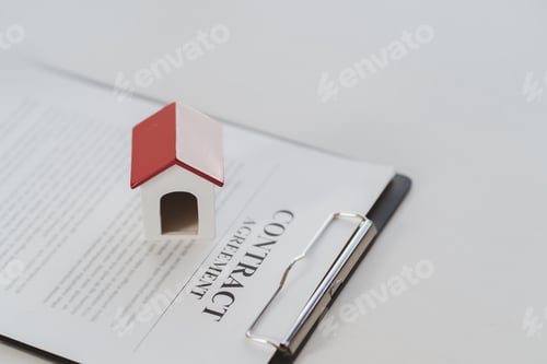 Preview: Male real estate agent hands counting money after successful deal for buying house.