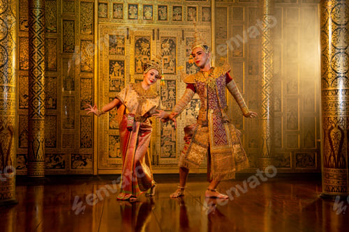Preview: Beautiful Asian woman wear Thai traditional dress action of dancing together with man stand