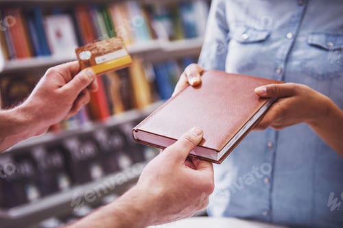 Preview: Girl with credit card at the bookshop
