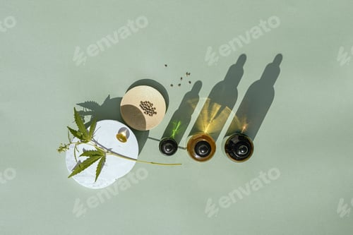 Preview: CBD oil in bottle and cannabis bush, hemp, white podium