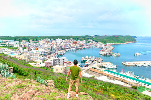 Preview: Traveler standing on best view point of beautiful port village. Enjoy the great landscape
