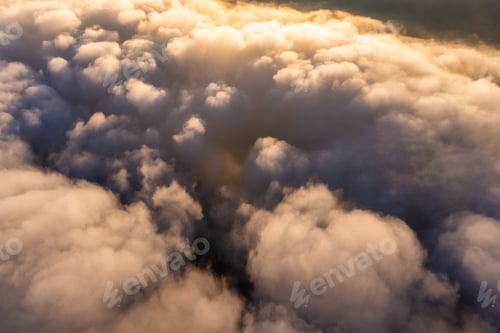 Preview: Thick layer of white clouds above mountains at sunrise