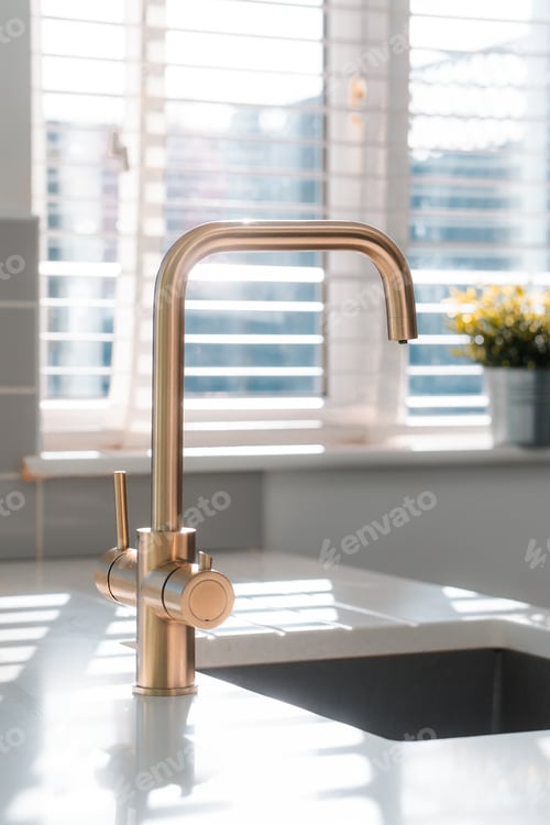 Preview: Gold kitchen tap faucet and sink, clean home interior