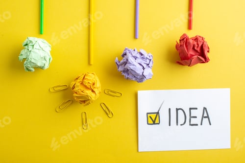 Preview: top view colorful squeezed papers with sticks and idea note on yellow background college color photo