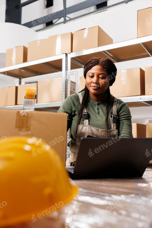 Preview: African american supervisor using cardboard boxes