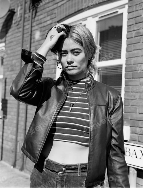 Preview: Analog portrait of mixed race woman in the street.