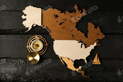 Preview: Columbus Day. Vintage compass with wooden model of America