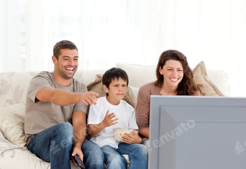 Preview: Family Laughing While Watching Television Together In The Living-Room