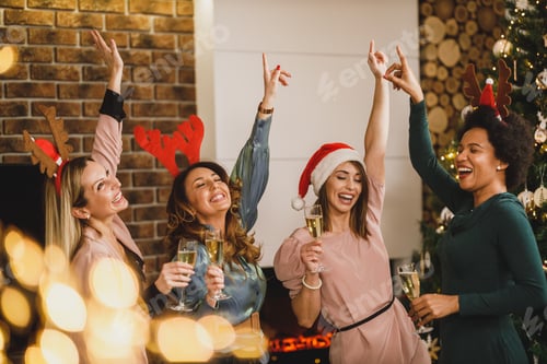 Preview: Four Multietnic Female Friends Having Fun And Dancing At Home Christmas Party