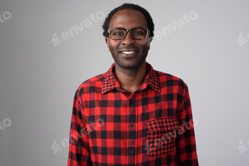 Preview: Portrait of happy African hipster man smiling with eyeglasses