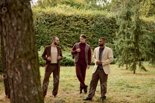Preview: Stylish men in autumn attire enjoying nature in a vibrant field during the fall season