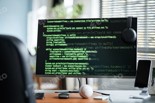 Preview: Coding on Computer Monitor in Modern Office Workspace