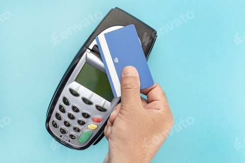 Preview: Hand make payment with credit card with NFC contactless technology on terminal device