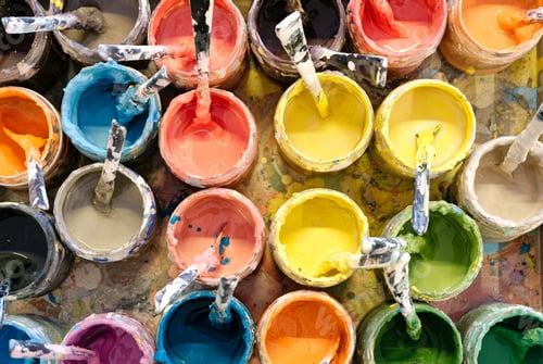 Preview: Large group of open cans of multi-colored paints