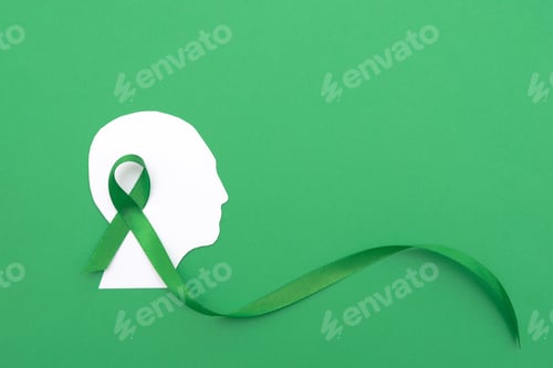 Preview: Silhouette of a Human Head with large Green Ribbon on Green Background
