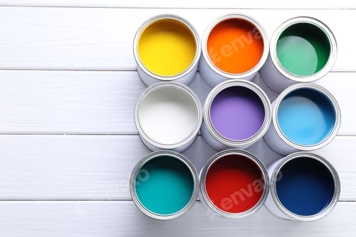 Preview: Cans of bright paints on white wooden table, flat lay. Space for text