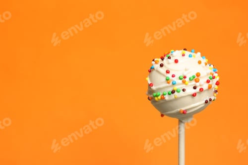 Preview: Bright delicious cake pop on color background. Space for text