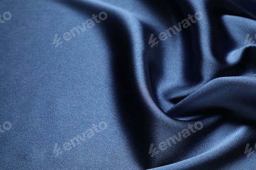 Preview: Blue crumpled silk fabric as background, above view