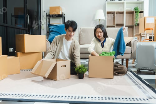 Preview: Smiling couple happy moving to a new house.