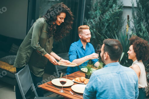 Preview: Cheerful young people have lunch in the courtyard and have a fun