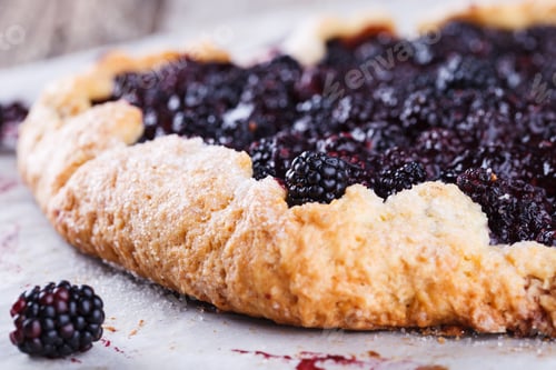 Preview: Sweet pastries with berries. Dessert.Galette with blackberries