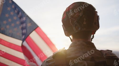 Preview: American Military Observes The US Flag At Sunset During Veteran Day Holiday
